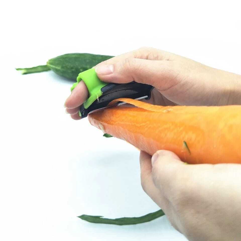 Vegetable And Fruit Peeler With Finger Grip